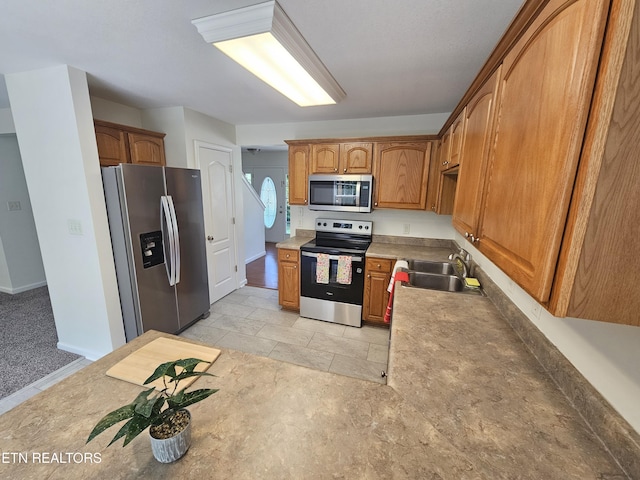 209 Cherokee Trl, Seymour, TN 37865 - kitchen featuring appliances with stainless steel finishes and brown cabinetry