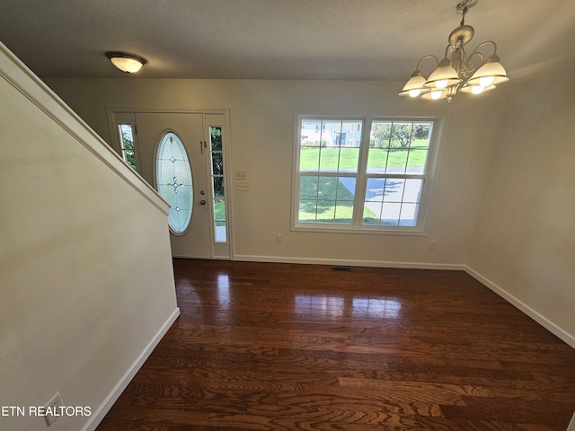 209 Cherokee Trl, Seymour, TN 37865 - entryway featuring a chandelier, dark wood-style flooring, and a textured ceiling
