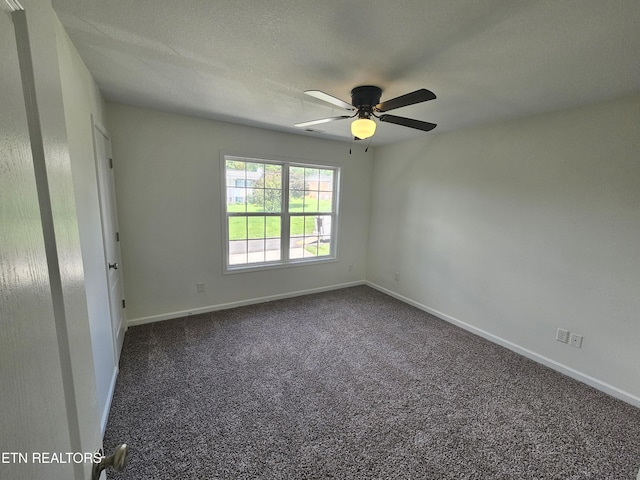 209 Cherokee Trl, Seymour, TN 37865 - empty room featuring a ceiling fan and dark colored carpet