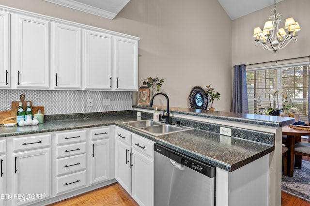 10867 Carpenter Run Ln Unit 44, Knoxville, TN 37932 - kitchen featuring stainless steel dishwasher, a peninsula, a chandelier, white cabinets, and dark countertops