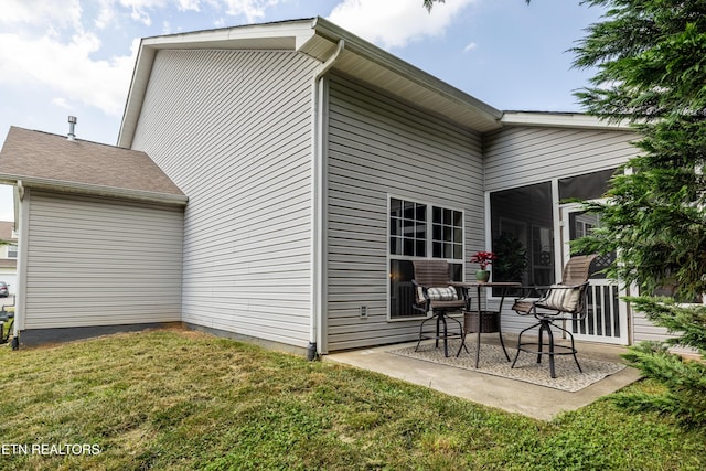 10867 Carpenter Run Ln Unit 44, Knoxville, TN 37932 - back of house featuring a yard, a patio, and a sunroom