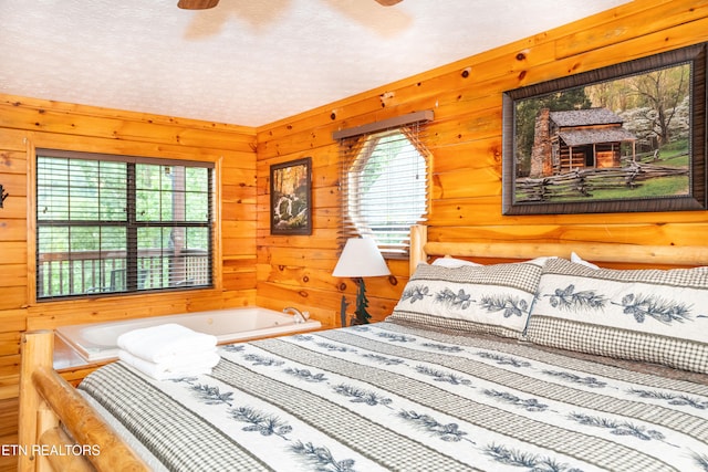 1507 Boo Boos Way, Sevierville, TN 37862 - bedroom featuring multiple windows and wooden walls