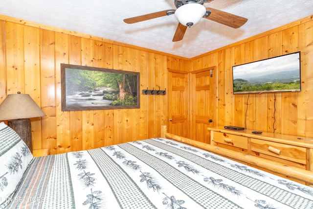 1507 Boo Boos Way, Sevierville, TN 37862 - bedroom featuring wooden walls and a ceiling fan