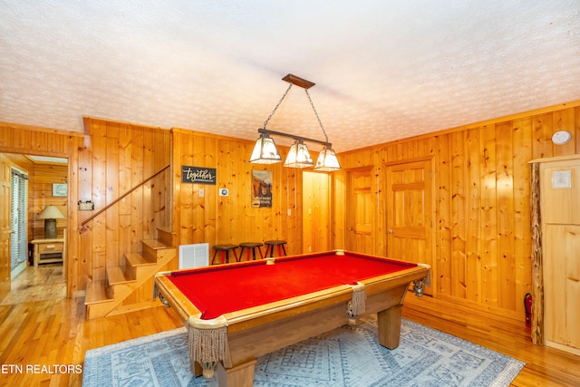 1507 Boo Boos Way, Sevierville, TN 37862 - playroom with pool table, light wood finished floors, wooden walls, and a textured ceiling