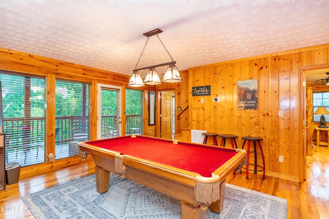 1507 Boo Boos Way, Sevierville, TN 37862 - game room with healthy amount of natural light, billiards table, a textured ceiling, wood finished floors, and wooden walls