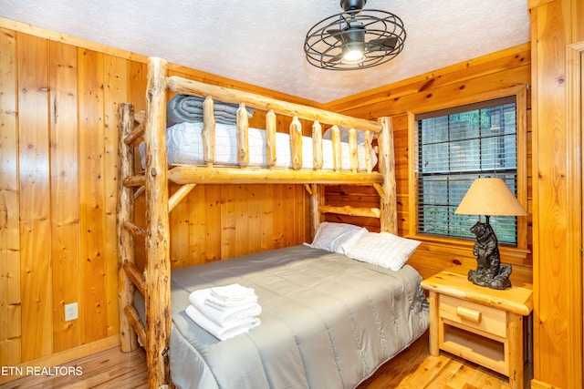 1507 Boo Boos Way, Sevierville, TN 37862 - bedroom with wood walls and wood finished floors