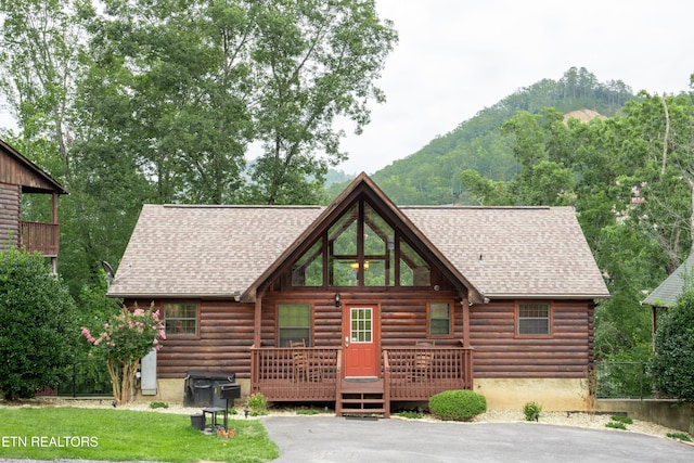 1507 Boo Boos Way, Sevierville, TN 37862 - view of front facade featuring log siding, a wooden deck, and roof with shingles