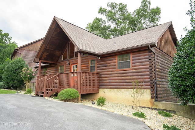 1507 Boo Boos Way, Sevierville, TN 37862 - log cabin with roof with shingles, log exterior, and a deck