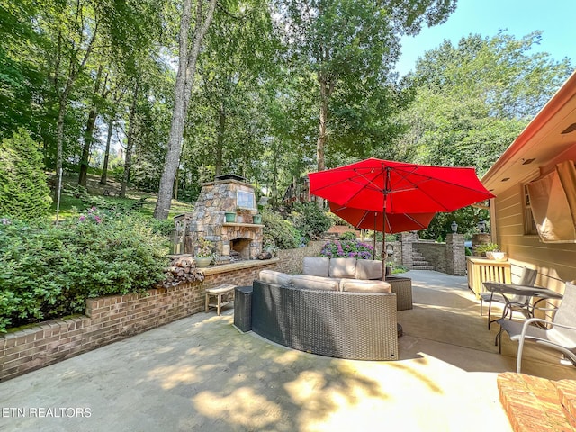 12218 Torrey Pines Pt, Knoxville, TN 37934 - view of patio with an outdoor living space with a fireplace and view of wooded area