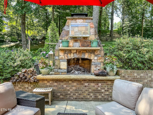 12218 Torrey Pines Pt, Knoxville, TN 37934 - view of patio / terrace with an outdoor stone fireplace