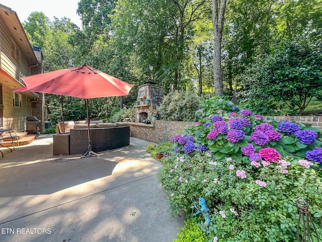 12218 Torrey Pines Pt, Knoxville, TN 37934 - view of patio / terrace featuring an outdoor living space with a fireplace and grilling area