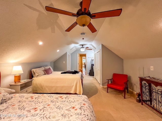 12218 Torrey Pines Pt, Knoxville, TN 37934 - bedroom with light colored carpet, a closet, vaulted ceiling, ceiling fan, and a textured ceiling