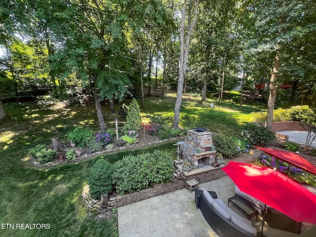 12218 Torrey Pines Pt, Knoxville, TN 37934 - view of green lawn featuring a patio area and view of wooded area