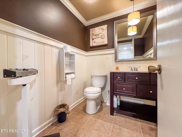 12218 Torrey Pines Pt, Knoxville, TN 37934 - bathroom featuring crown molding, vanity, tile patterned flooring, a wainscoted wall, and a decorative wall