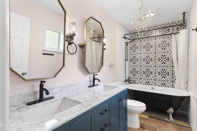101 Concord Rd, Oak Ridge, TN 37830 - bathroom with double vanity, a chandelier, wood finished floors, and shower / bath combination with curtain