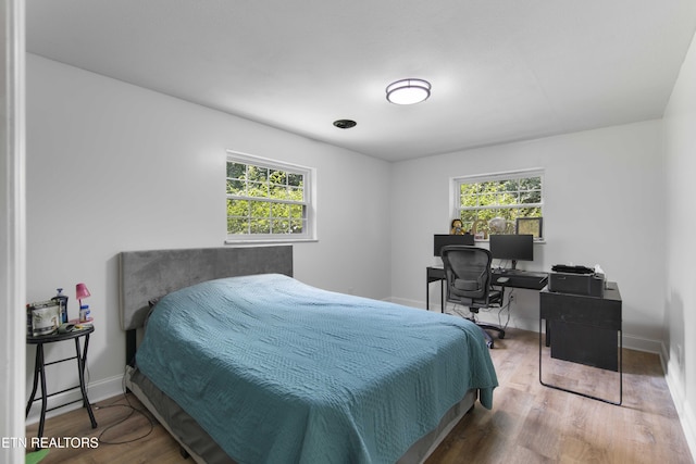 101 Concord Rd, Oak Ridge, TN 37830 - bedroom featuring multiple windows, wood finished floors, and a desk