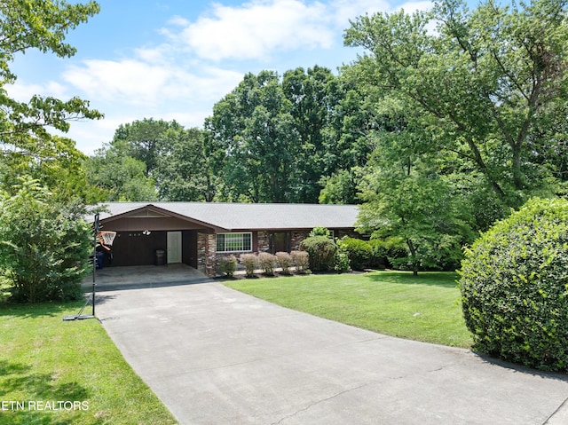 101 Concord Rd, Oak Ridge, TN 37830 - single story home with a carport, driveway, and a front yard