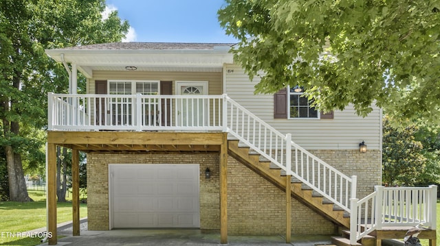 814 Plantation Dr, Pigeon Forge, TN 37863 - view of front of property with brick siding, a garage, and roof with shingles