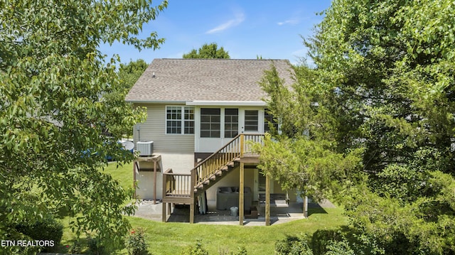 814 Plantation Dr, Pigeon Forge, TN 37863 - back of property with a patio, stairway, a lawn, roof with shingles, and a sunroom
