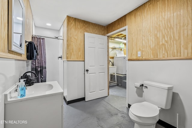 814 Plantation Dr, Pigeon Forge, TN 37863 - full bathroom featuring concrete flooring, vanity, a shower with curtain, and washer and dryer