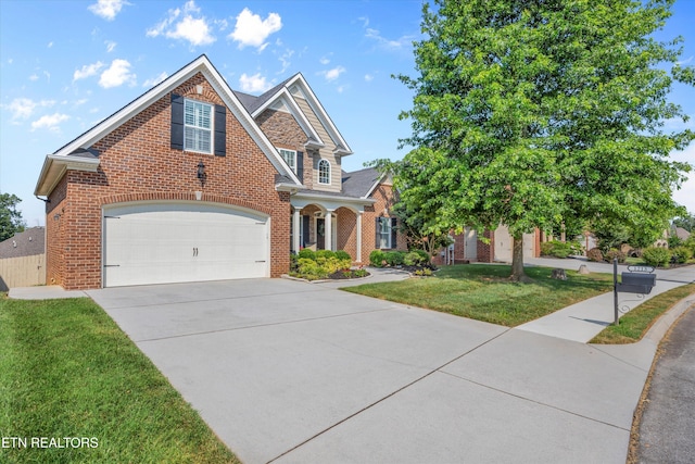 1213 Whisper Trace Ln, Knoxville, TN 37919 - traditional home with brick siding, driveway, a front yard, and a garage