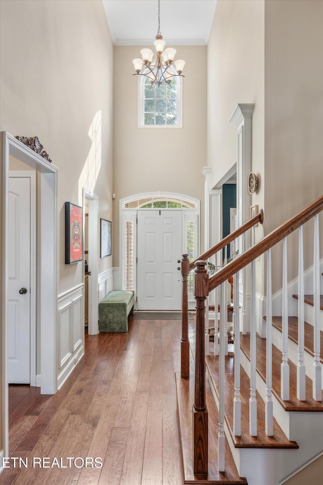 1213 Whisper Trace Ln, Knoxville, TN 37919 - entryway with a chandelier, hardwood / wood-style flooring, stairway, a high ceiling, and a wainscoted wall