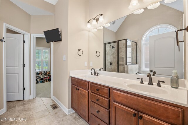 1213 Whisper Trace Ln, Knoxville, TN 37919 - full bathroom with a shower stall, double vanity, tile patterned floors, and lofted ceiling