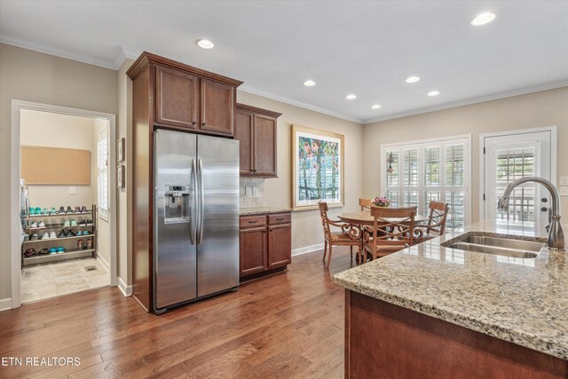 1213 Whisper Trace Ln, Knoxville, TN 37919 - kitchen with stainless steel refrigerator with ice dispenser, ornamental molding, dark wood-style flooring, recessed lighting, and light stone countertops