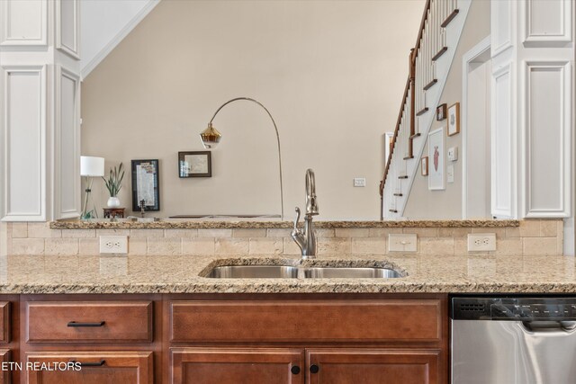 1213 Whisper Trace Ln, Knoxville, TN 37919 - kitchen with dishwasher, brown cabinets, light stone counters, and backsplash