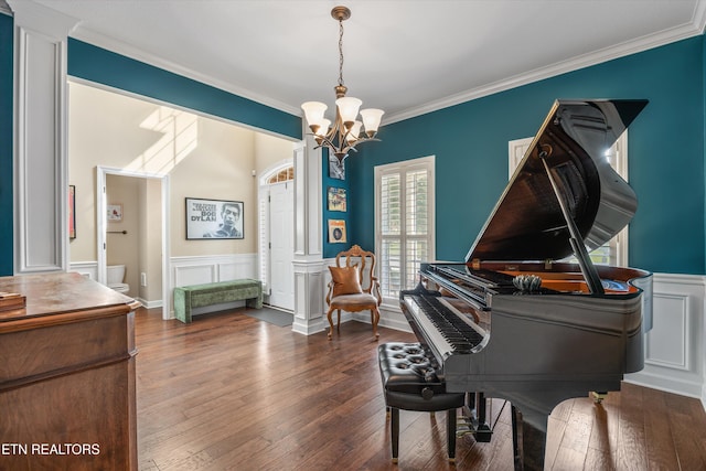1213 Whisper Trace Ln, Knoxville, TN 37919 - sitting room with a chandelier, crown molding, a wainscoted wall, wood-type flooring, and a decorative wall
