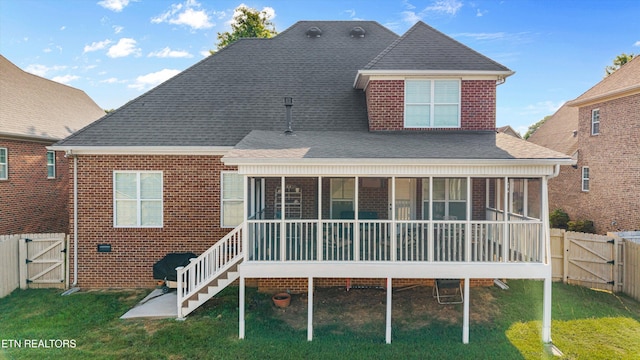 1213 Whisper Trace Ln, Knoxville, TN 37919 - back of house with a gate, a sunroom, a fenced backyard, brick siding, and roof with shingles