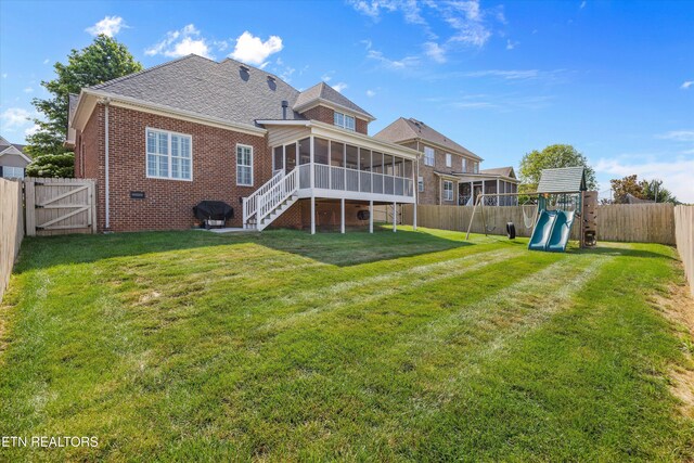 1213 Whisper Trace Ln, Knoxville, TN 37919 - rear view of house featuring a sunroom, a fenced backyard, brick siding, and a gate