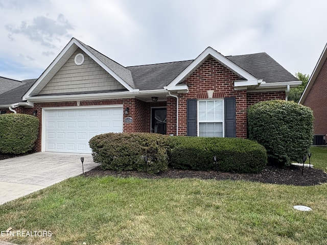 8106 Spice Tree Way, Knoxville, TN 37931 - view of front of house with brick siding, driveway, a garage, and a front lawn