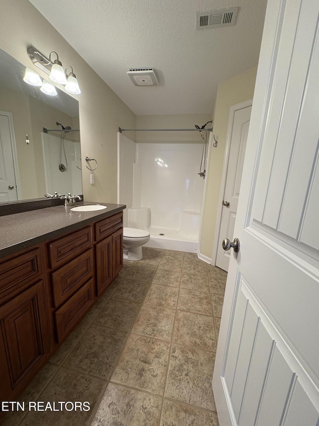 8106 Spice Tree Way, Knoxville, TN 37931 - full bathroom featuring walk in shower, vanity, and a textured ceiling