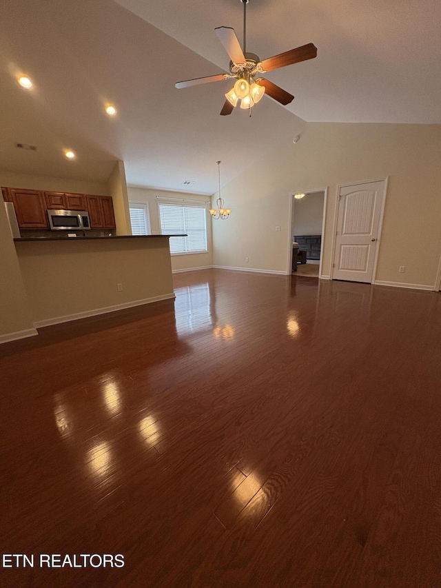 8106 Spice Tree Way, Knoxville, TN 37931 - unfurnished living room featuring a ceiling fan, dark wood-style floors, lofted ceiling, recessed lighting, and a chandelier