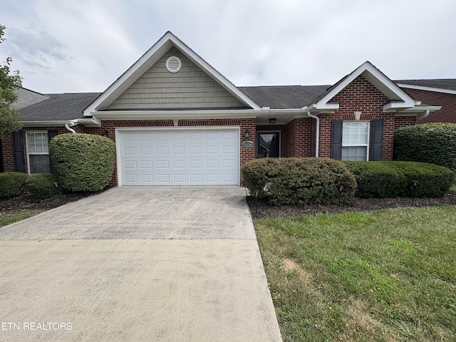 8106 Spice Tree Way, Knoxville, TN 37931 - ranch-style home with driveway, an attached garage, brick siding, and a front lawn