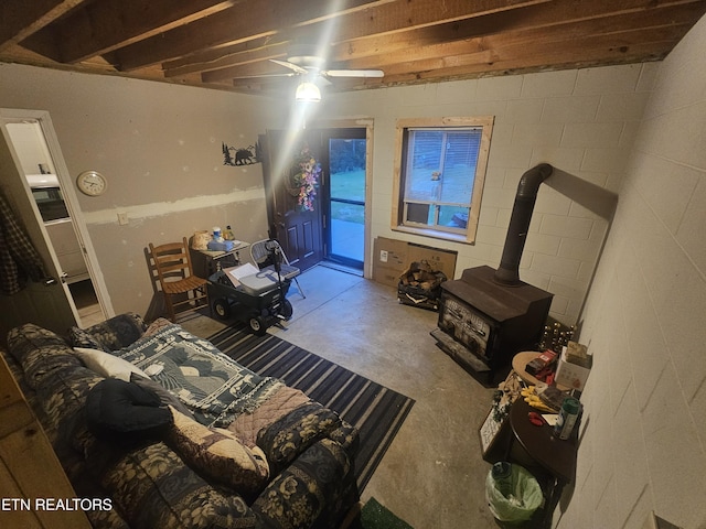 199 Pear Tree Way, Del Rio, TN 37727 - bedroom with unfinished concrete flooring, access to outside, and a wood stove