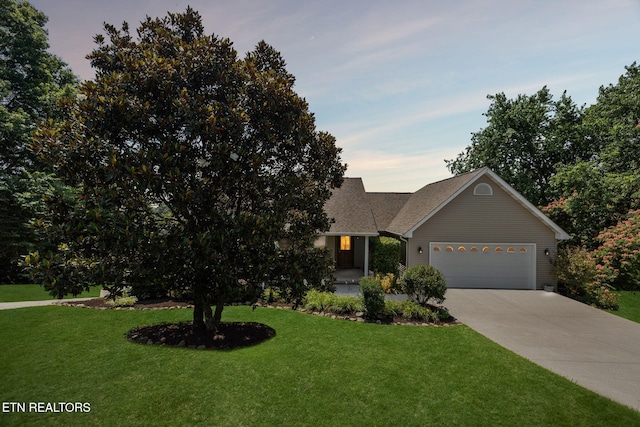 3930 Settlers Trl, Kodak, TN 37764 - view of front of home featuring a garage, a yard, concrete driveway, and roof with shingles