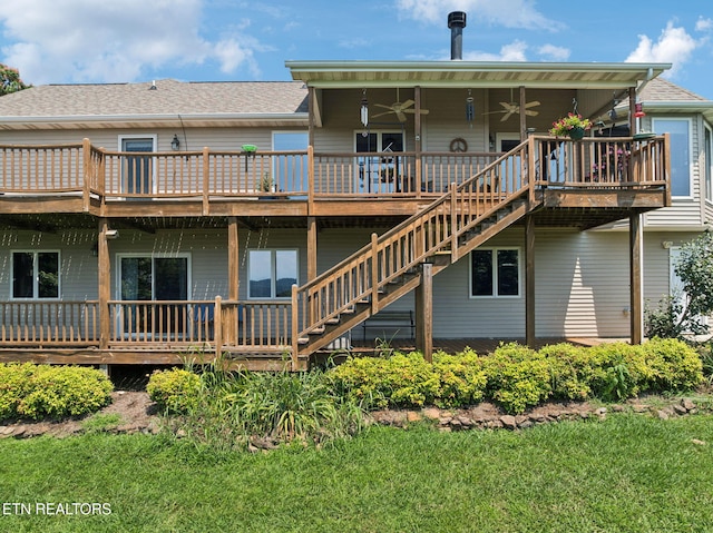 3930 Settlers Trl, Kodak, TN 37764 - rear view of property featuring a ceiling fan, a wooden deck, stairway, roof with shingles, and a yard