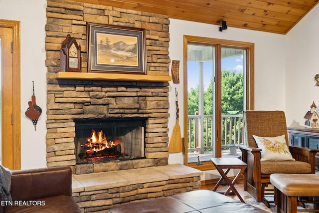 3930 Settlers Trl, Kodak, TN 37764 - living area with a stone fireplace, wooden ceiling, wood finished floors, and lofted ceiling