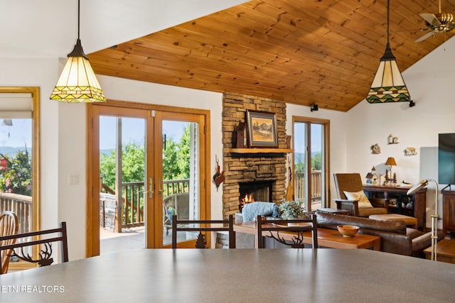 3930 Settlers Trl, Kodak, TN 37764 - living area with french doors, vaulted ceiling, healthy amount of natural light, a stone fireplace, and wood ceiling