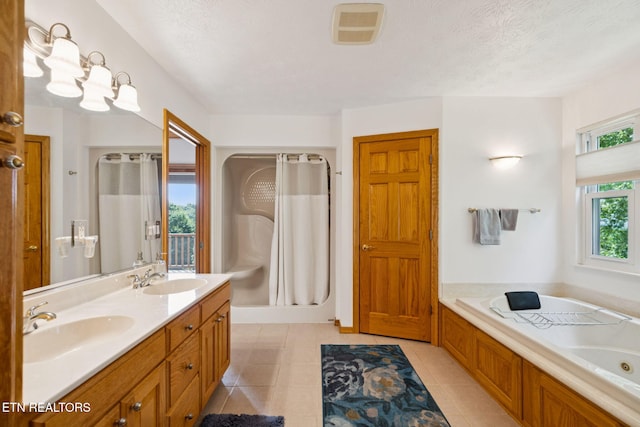 3930 Settlers Trl, Kodak, TN 37764 - bathroom with a jetted tub, double vanity, a stall shower, and tile patterned floors