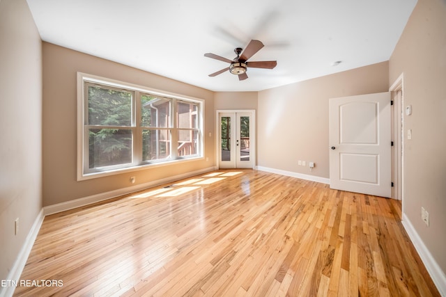 1328 E Millers Cove Rd, Walland, TN 37886 - unfurnished room featuring french doors, ceiling fan, and light wood-style floors