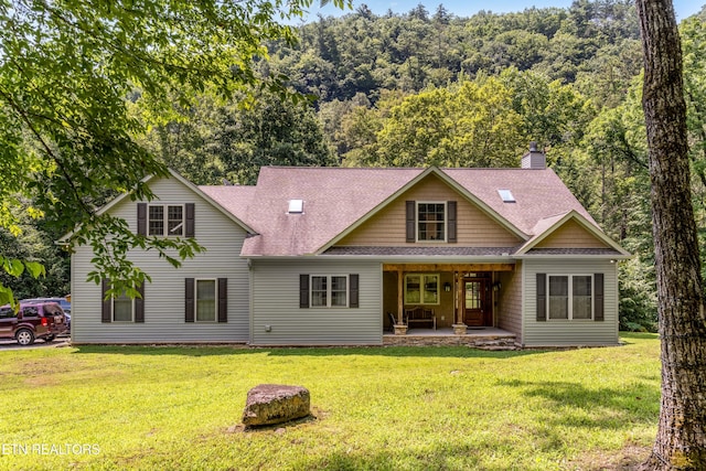 1328 E Millers Cove Rd, Walland, TN 37886 - view of front of house featuring roof with shingles, a chimney, and a front yard
