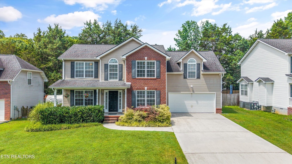 3313 Maple Valley Ln, Knoxville, TN 37931 - traditional-style home featuring concrete driveway, an attached garage, brick siding, and a shingled roof