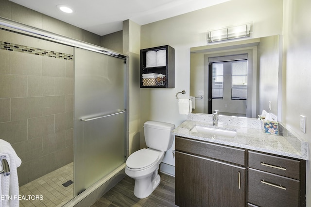 603 W Main St Unit 201, Knoxville, TN 37902 - bathroom with vanity, a stall shower, and wood finished floors