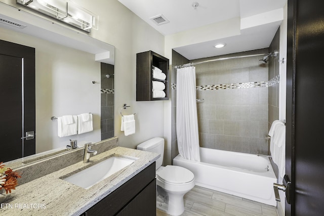 603 W Main St Unit 201, Knoxville, TN 37902 - full bathroom with vanity, shower / tub combo, wood finished floors, and recessed lighting