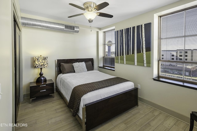 603 W Main St Unit 201, Knoxville, TN 37902 - bedroom featuring wood finished floors and ceiling fan
