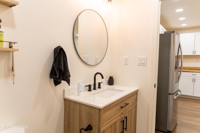 1210 Frank Campbell Rd, Jamestown, TN 38556 - bathroom with recessed lighting, vanity, and wood finished floors