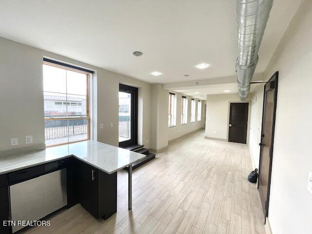 603 W Main St Unit 208, Knoxville, TN 37902 - hallway with light wood-style floors and baseboards